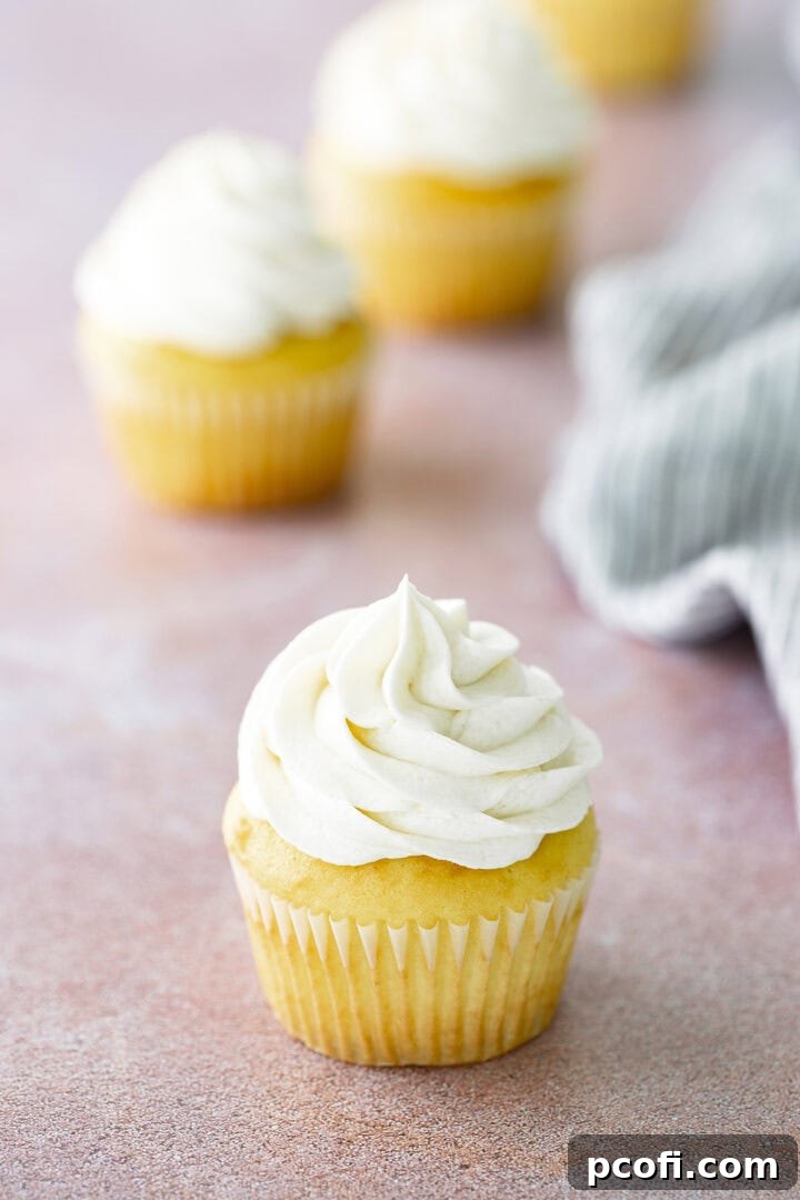Ermine frosting on a yellow cupcake