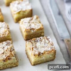 Close-up of baked almond blondies on a cutting board