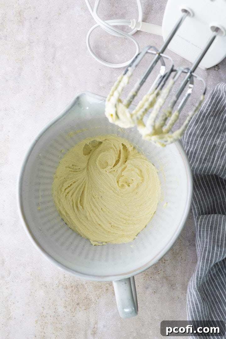 Dry ingredients mixed into frangipane, showing a smooth, creamy texture