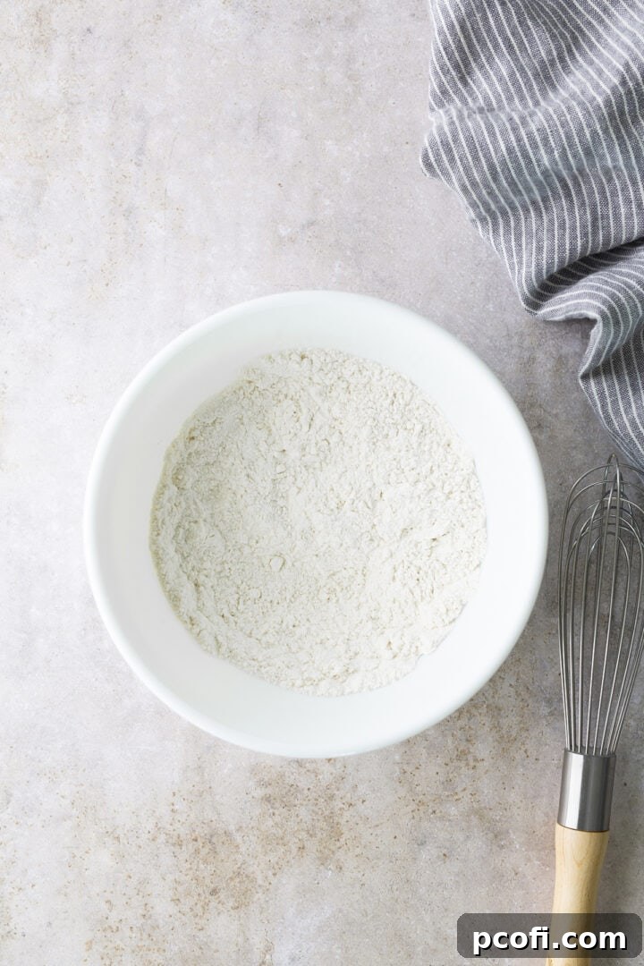 Dry ingredients for blondie batter in a bowl, a white flour mixture