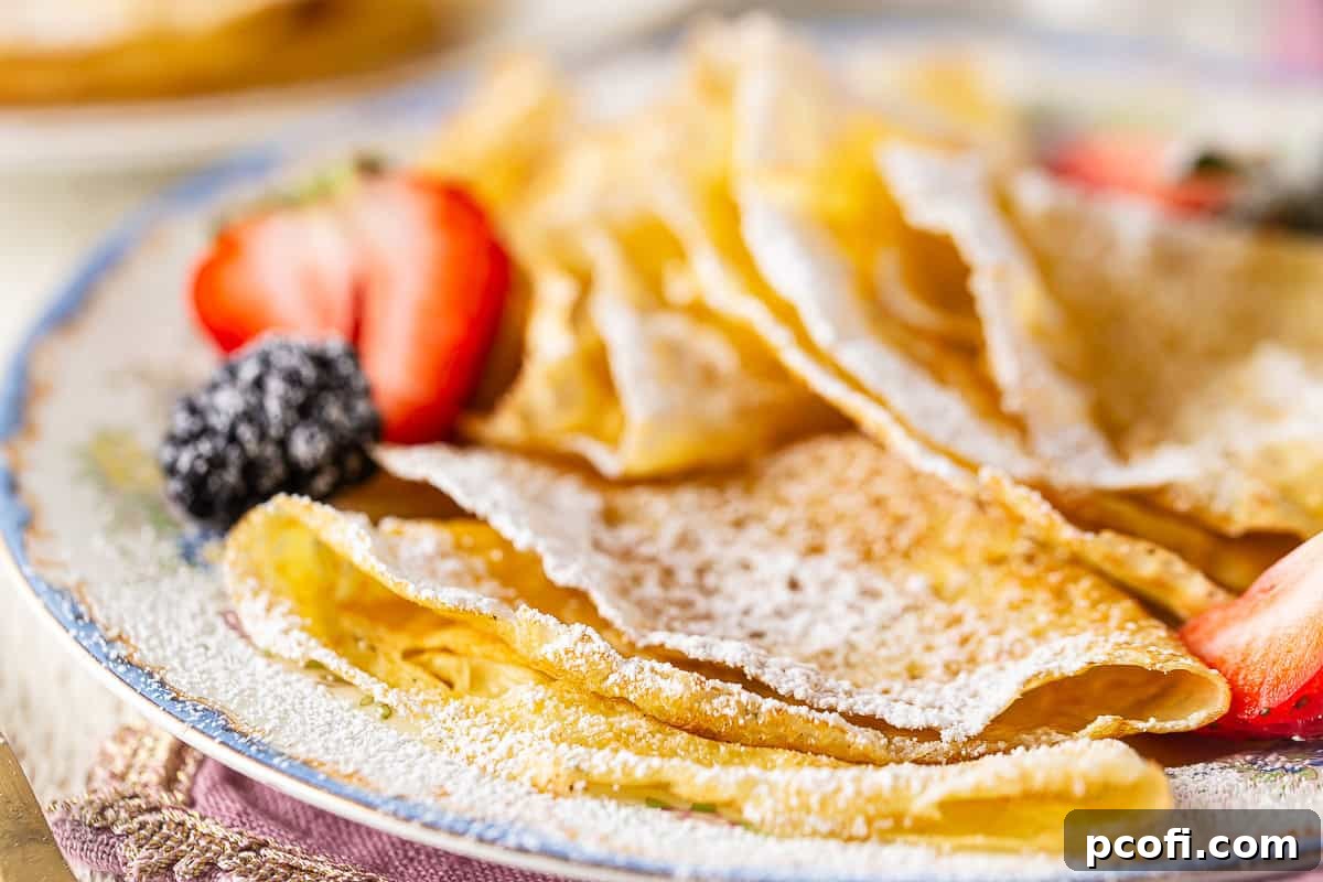 Thin, lacy homemade crepes served with fresh berries and powdered sugar.