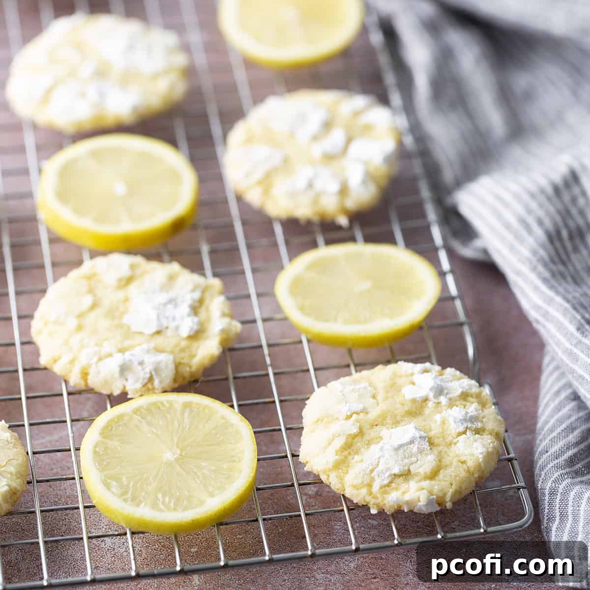 Lemon Crinkle Cookies on a wire cooling rack