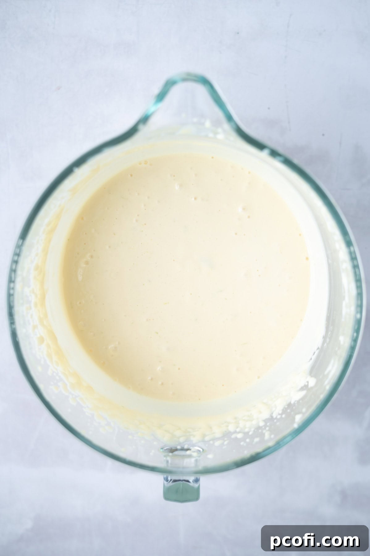 Creamy, thickened Atlantic Beach Pie filling in a mixing bowl after being whisked.