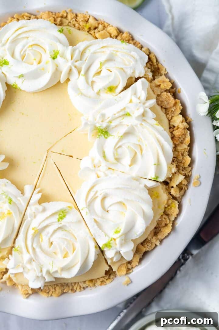 A beautifully garnished Atlantic Beach Pie with piped whipped cream, fresh lemon and lime zest, ready to be served.