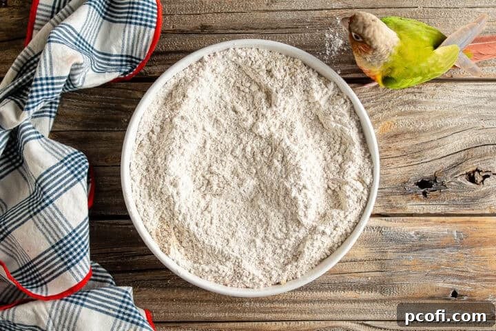 A bowl of well-mixed seasoned flour, ready to create the ultimate crispy coating for chicken tenders.
