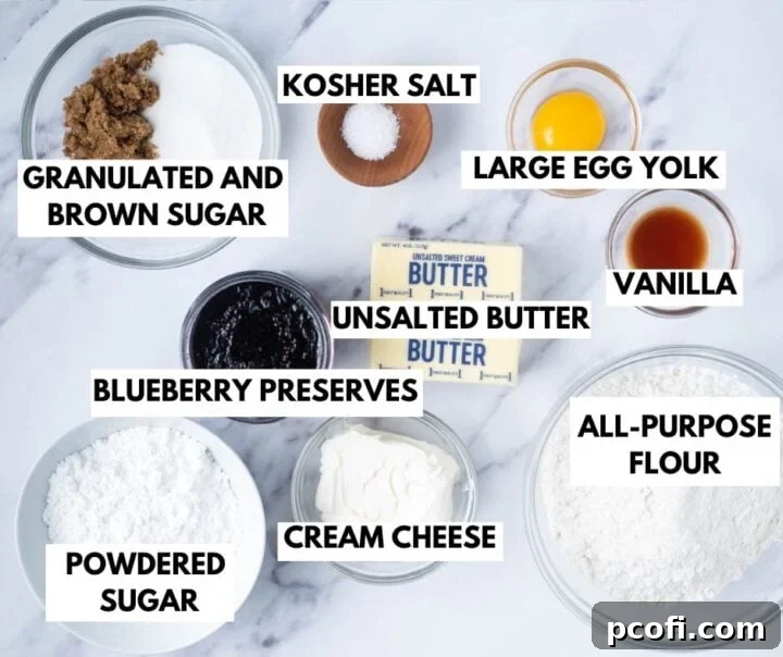 Various ingredients for making blueberry and cream cookies laid out on a surface
