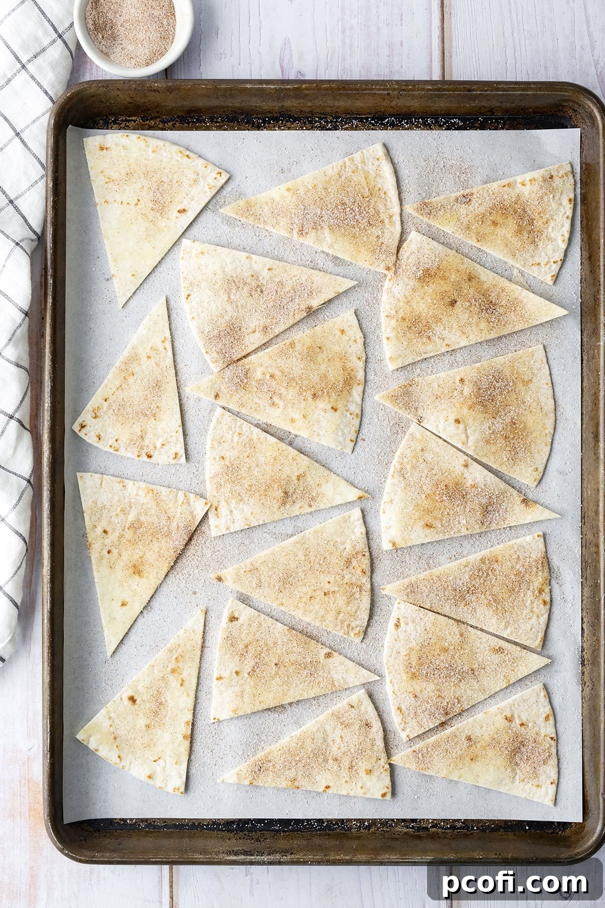 Cinnamon sugar sprinkled on tortilla wedges