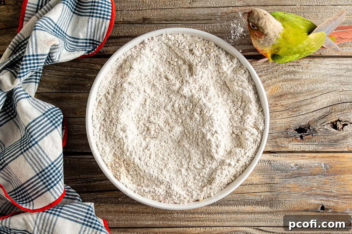 Close-up of a perfectly mixed breading mixture for extra crispy chicken tenders.
