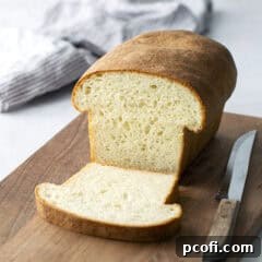 Sliced Homemade Potato Bread on a cutting board, ready to be served.