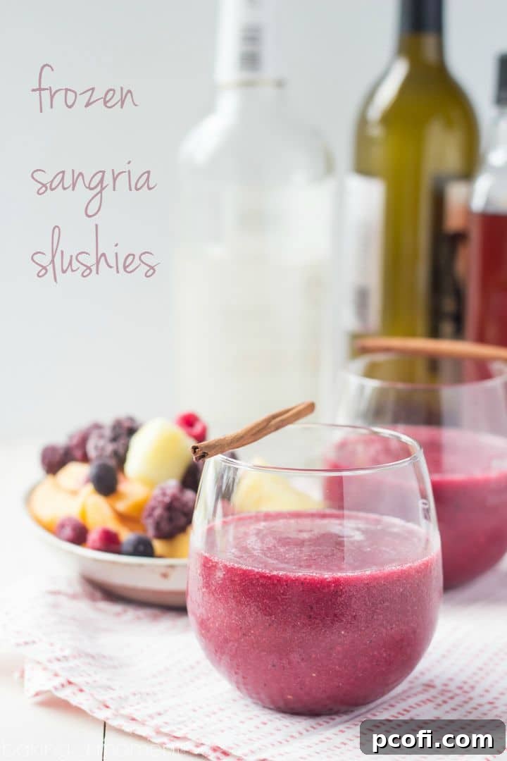 Close-up of a frosty Frozen Sangria Slushie, showcasing its icy texture and the vibrant red color.