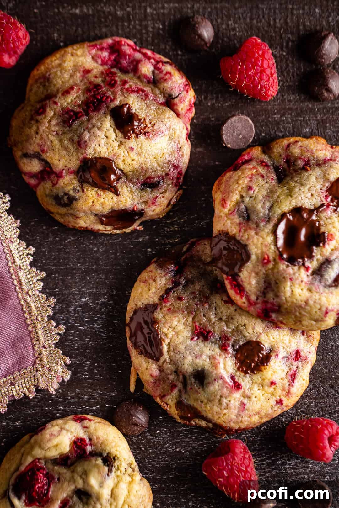Chocolate chip raspberry cookies on a baking sheet.