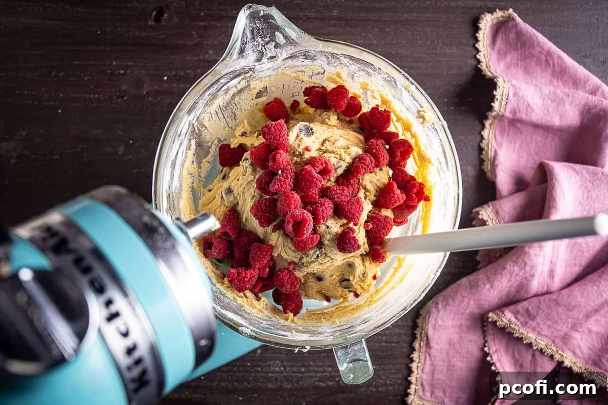 Frozen raspberries before being mixed into the cookie dough for raspberry chocolate chip cookies.