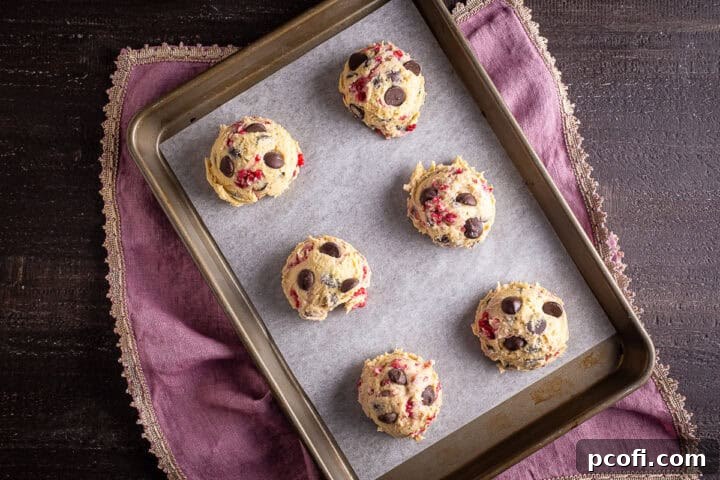 Unbaked cookies on a prepared baking sheet.