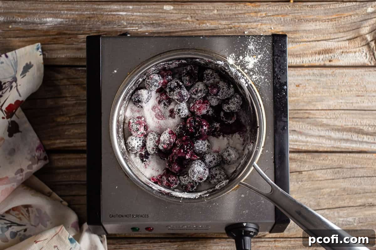 Blackberries, sugar, and cornstarch in a saucepan.