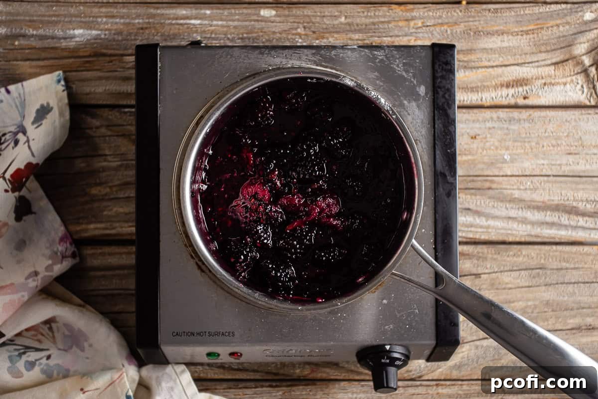 Blackberry Pie filling cooking in a sauce pan. 