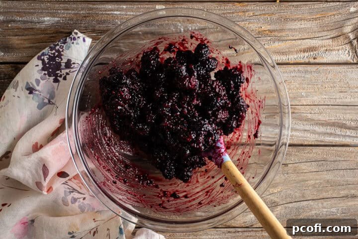 Blackberry pie filling after being mixed together with the fresh blackberries.