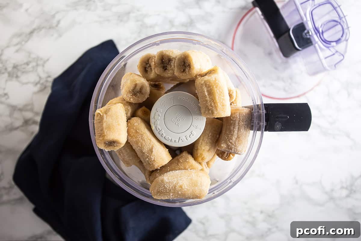 Frozen bananas in a food processor. 