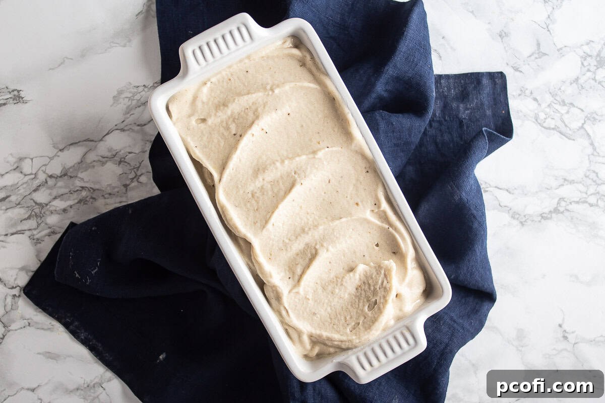 Banana nice cream in a loaf pan before being frozen to a scoopable consistency.