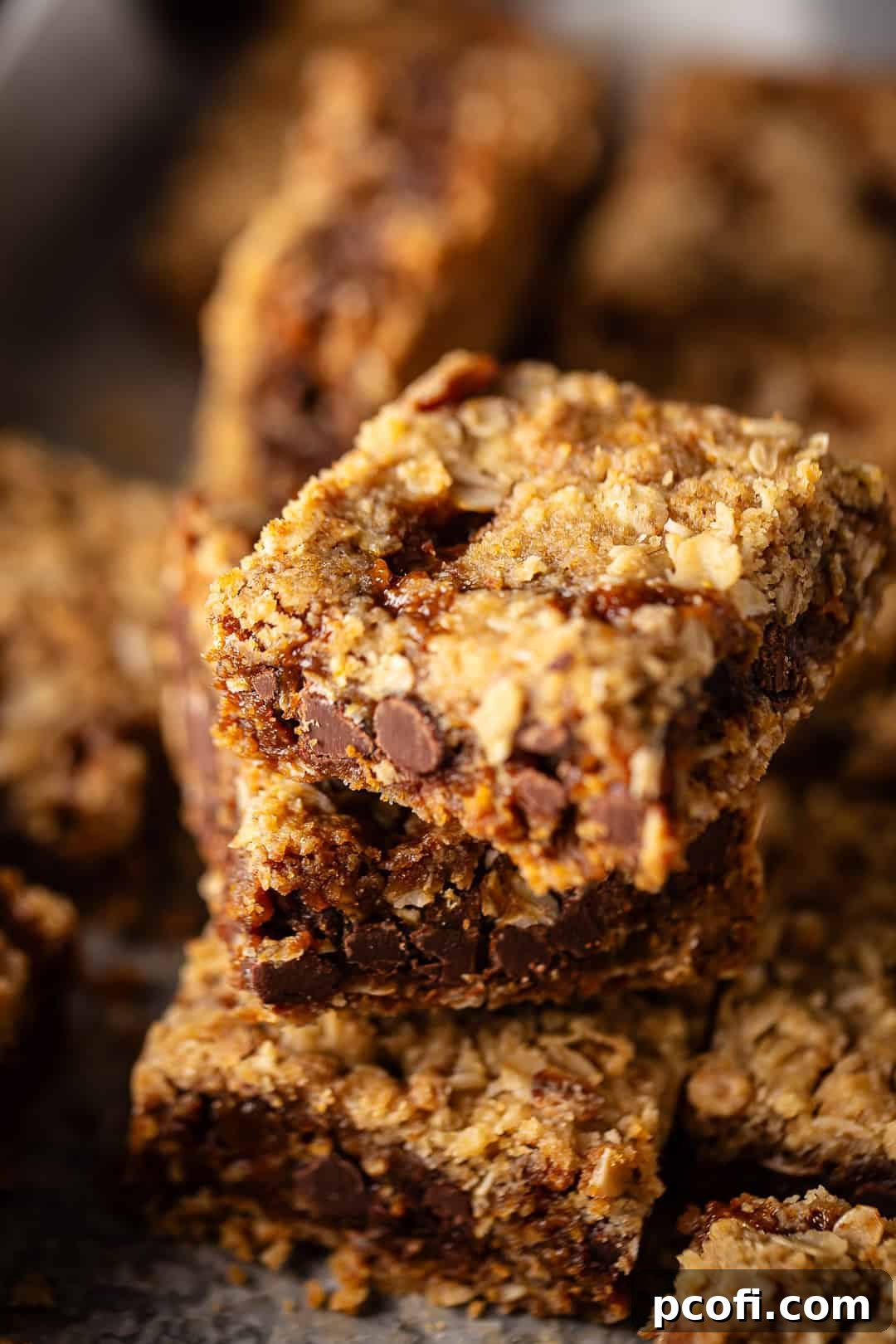 Oatmeal Carmelitas cut into bars and stacked on top of each other.