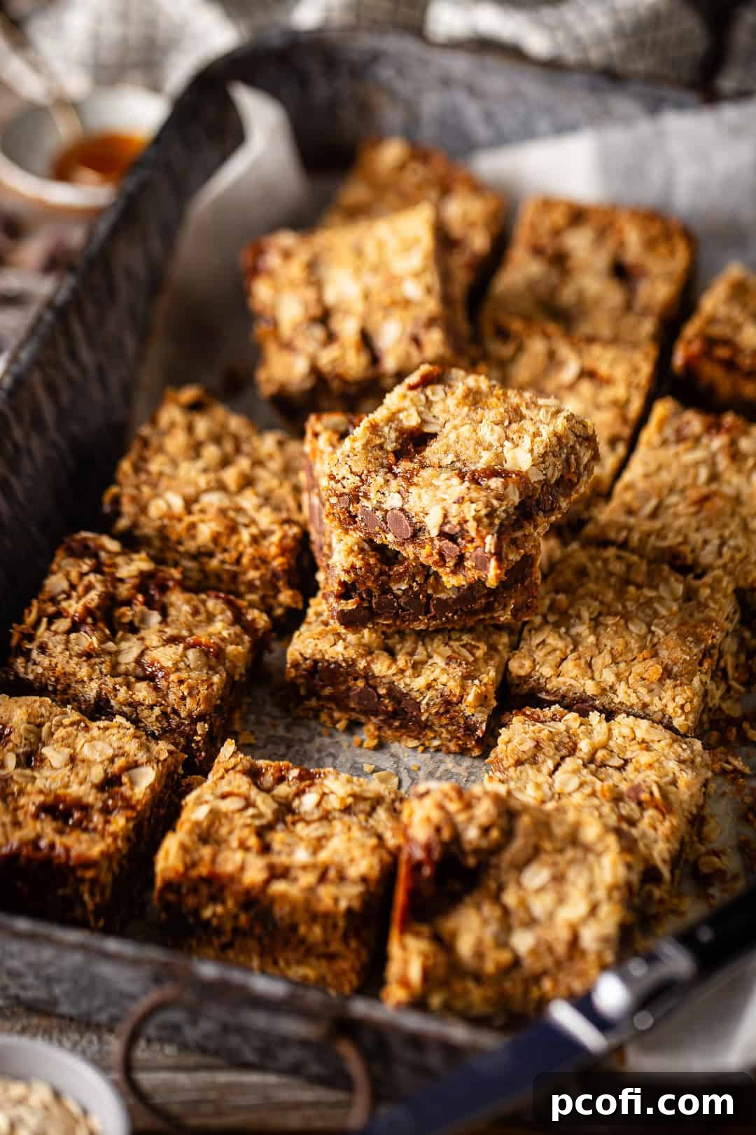 Oatmeal Carmelitas after being cut and placed into a large baking pan.