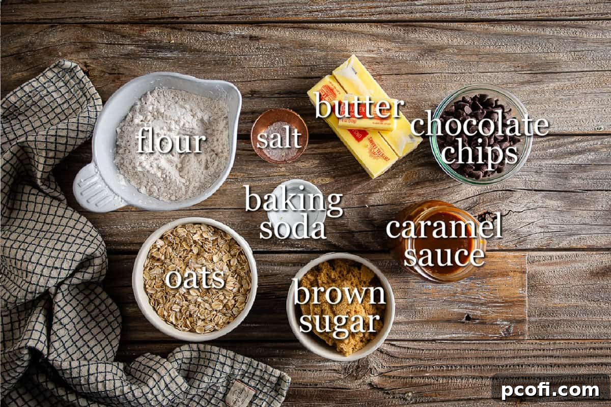 Ingredients for Oatmeal Carmelitas on a wooden background in separate containers.