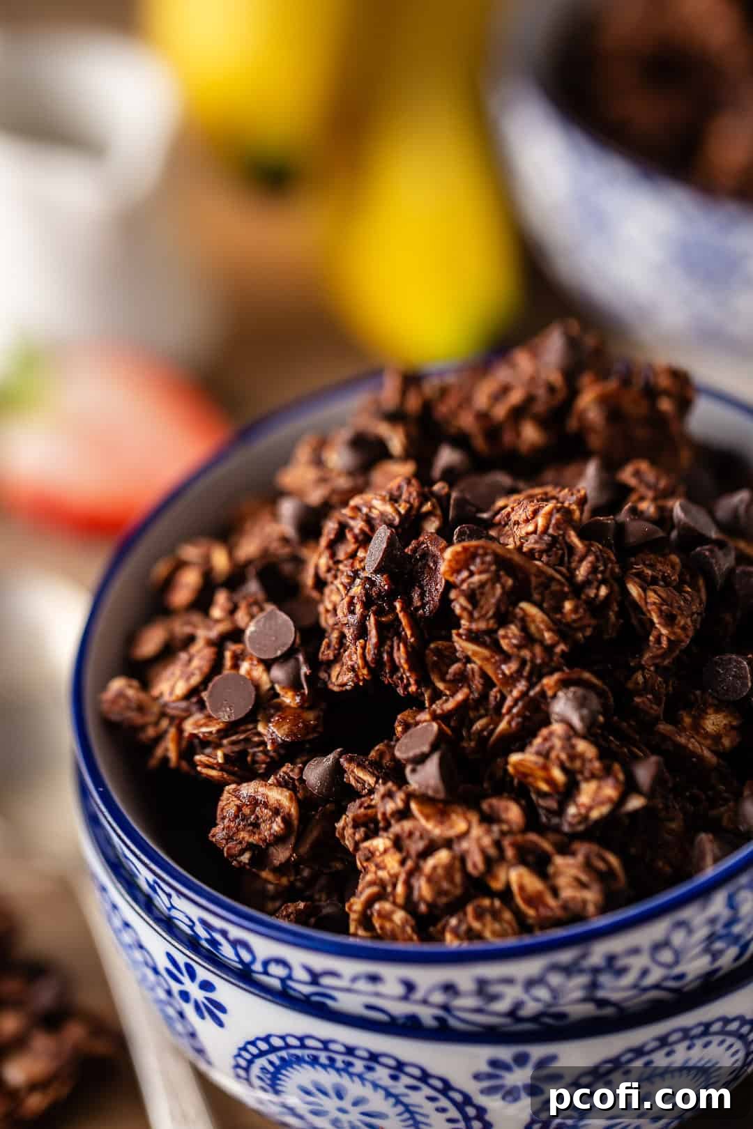 Chocolate granola in decorative bowls, ready to be enjoyed.