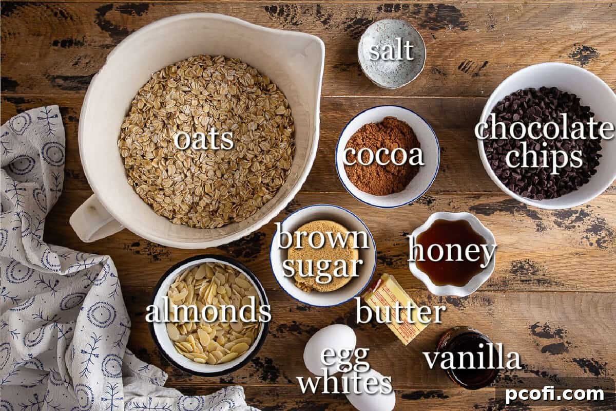 Ingredients for chocolate granola on a wooden background in separate containers, showcasing fresh oats, nuts, and chocolate.