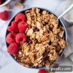 maple granola in a bowl with a spoon