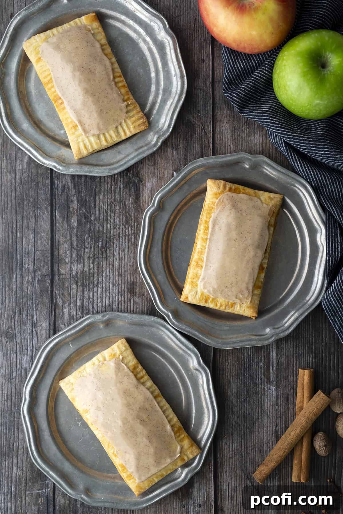 Pop tarts on silver plates, glistening with vanilla-cinnamon glaze