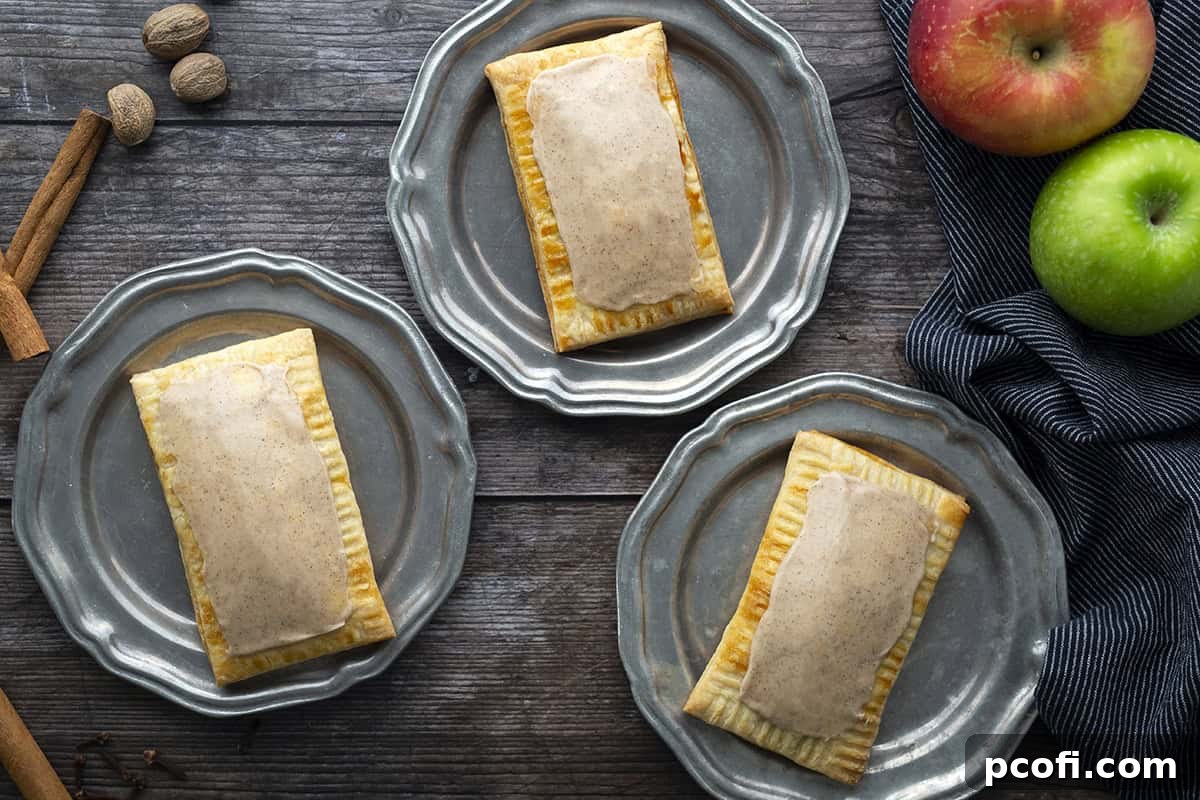 Finished apple cinnamon pop tarts arranged beautifully on plates