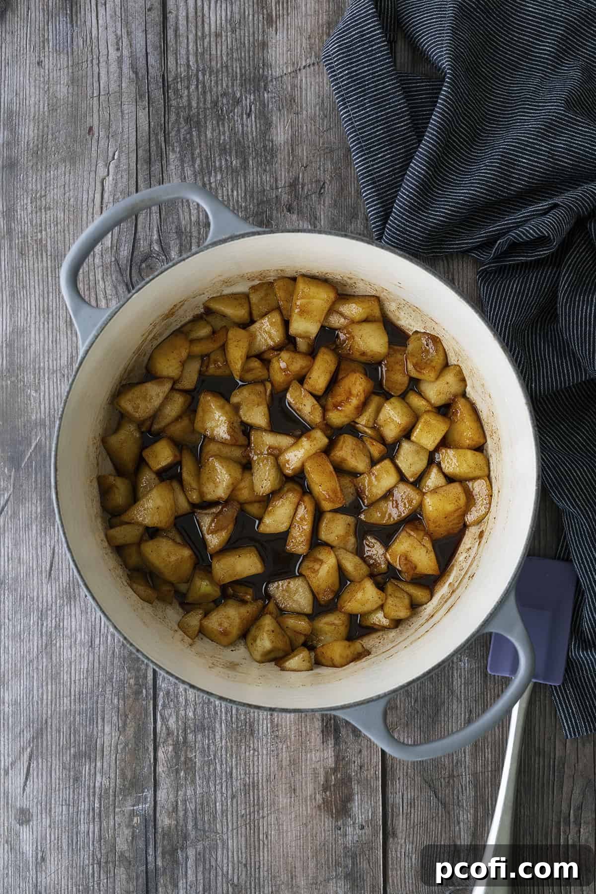 Apples cooking with spices in a Dutch oven