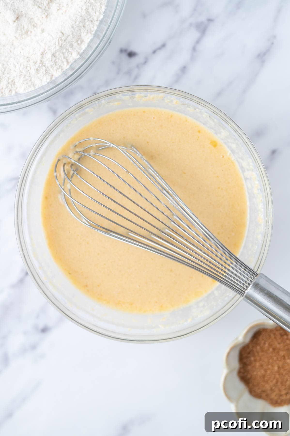 wet muffin ingredients whisked together in a bowl