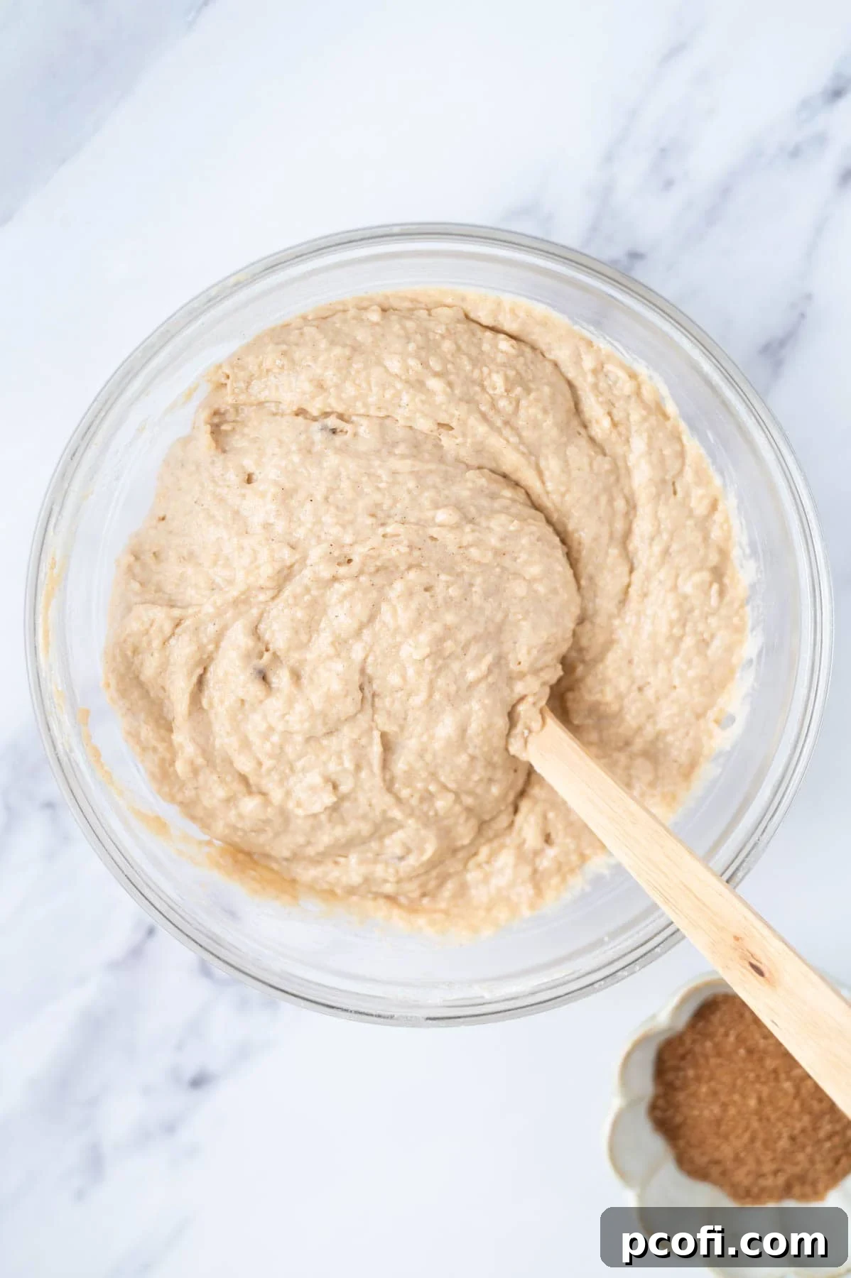 muffin batter in a bowl with a spatula