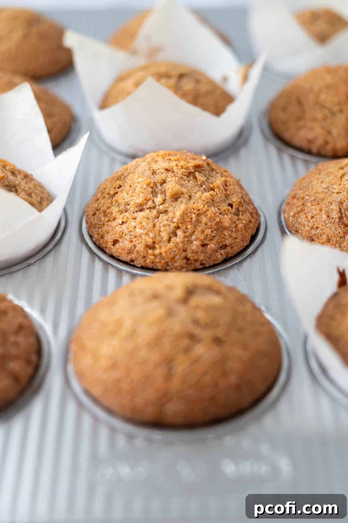 baked muffins with tall tops in a muffin tin