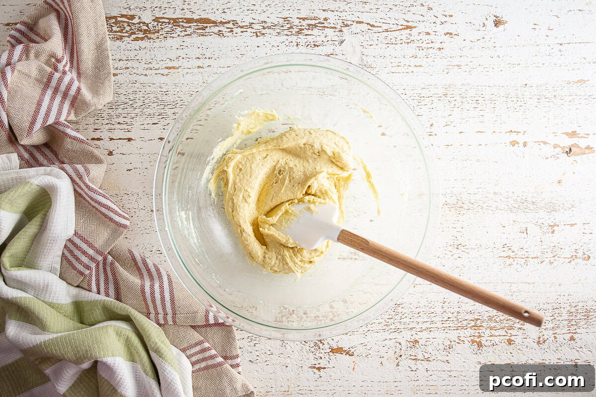 The pear tart filling fully mixed, showing a smooth and consistent almond frangipane.