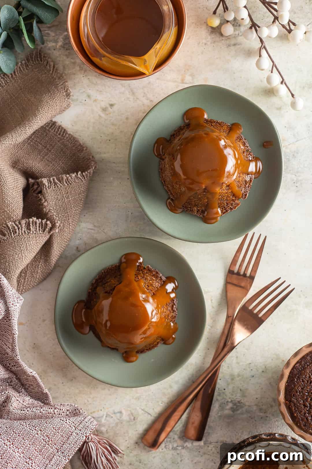 Classic Sticky Toffee Pudding served warm with a scoop of vanilla ice cream, ready to be enjoyed.