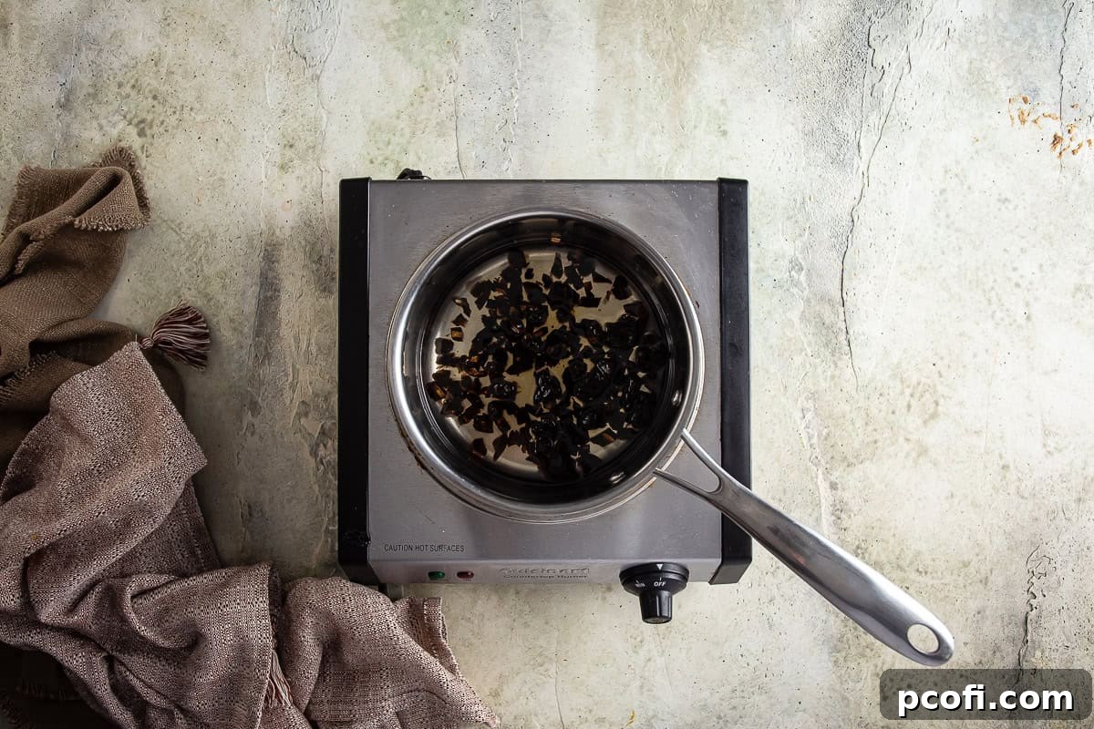 Dates being softened in water on the stovetop for the sticky toffee pudding batter.