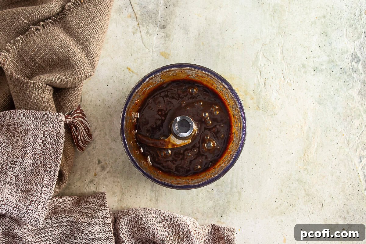 Dates after being softened and pureed to a smooth paste for the sticky toffee pudding.