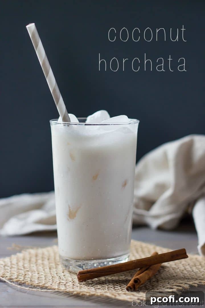 Close-up of Coconut Horchata in a glass, showcasing its creamy texture and a sprinkle of cinnamon, ready to be enjoyed