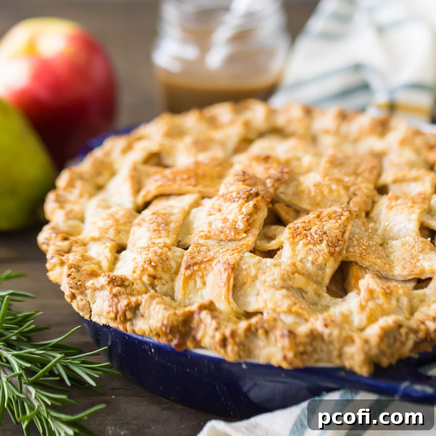 A beautifully baked Apple Pear Pie, with a golden crust and visible fruit filling.
