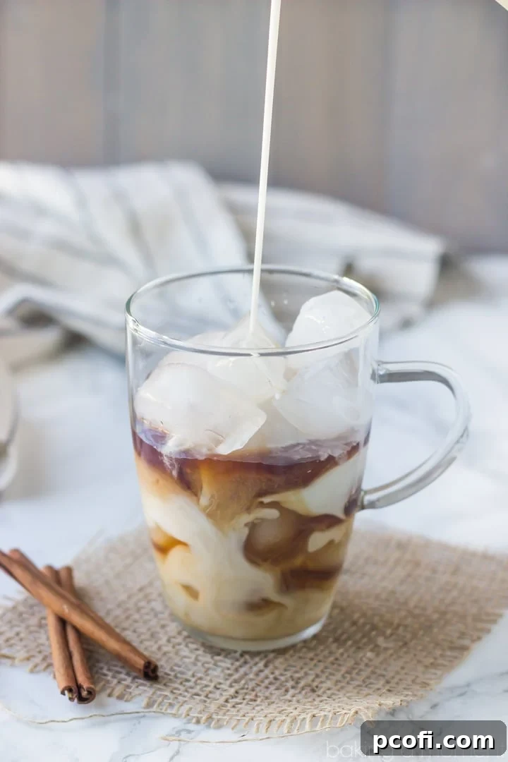A refreshing glass of Coconut Horchata Iced Coffee, showcasing its creamy texture and inviting layers of coffee and horchata.