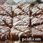 Moist and fudgy Oatmeal Raisin Blondies, infused with warm fall flavors, cut into squares.