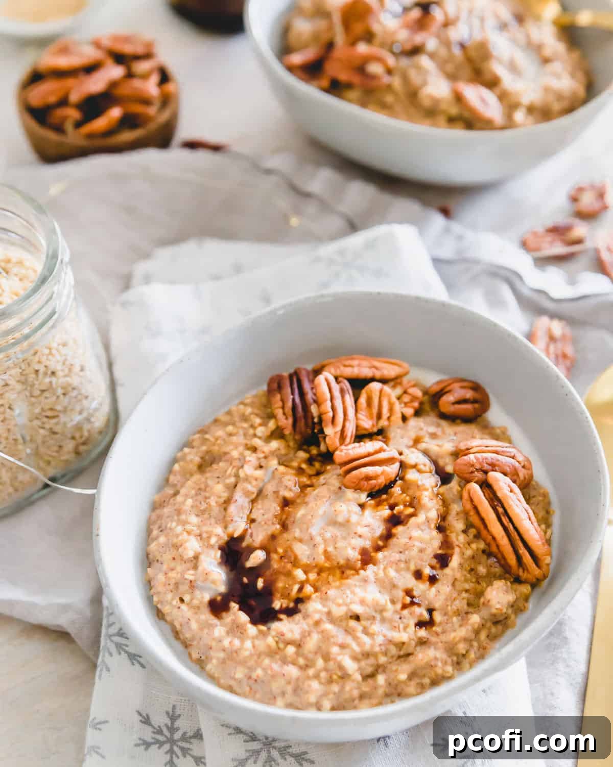 Hearty Gingerbread Oatmeal, made with steel cut oats and seasonal spices, served in a bowl.