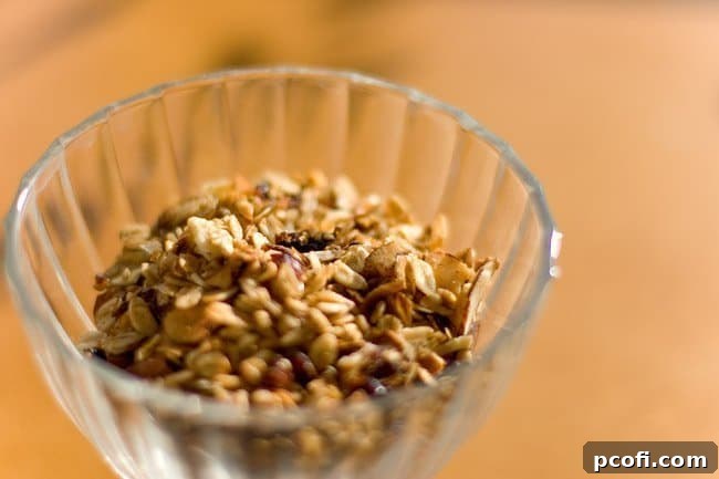 Maple almond slow cooker granola, emphasizing its ease of preparation for a seasonal breakfast.