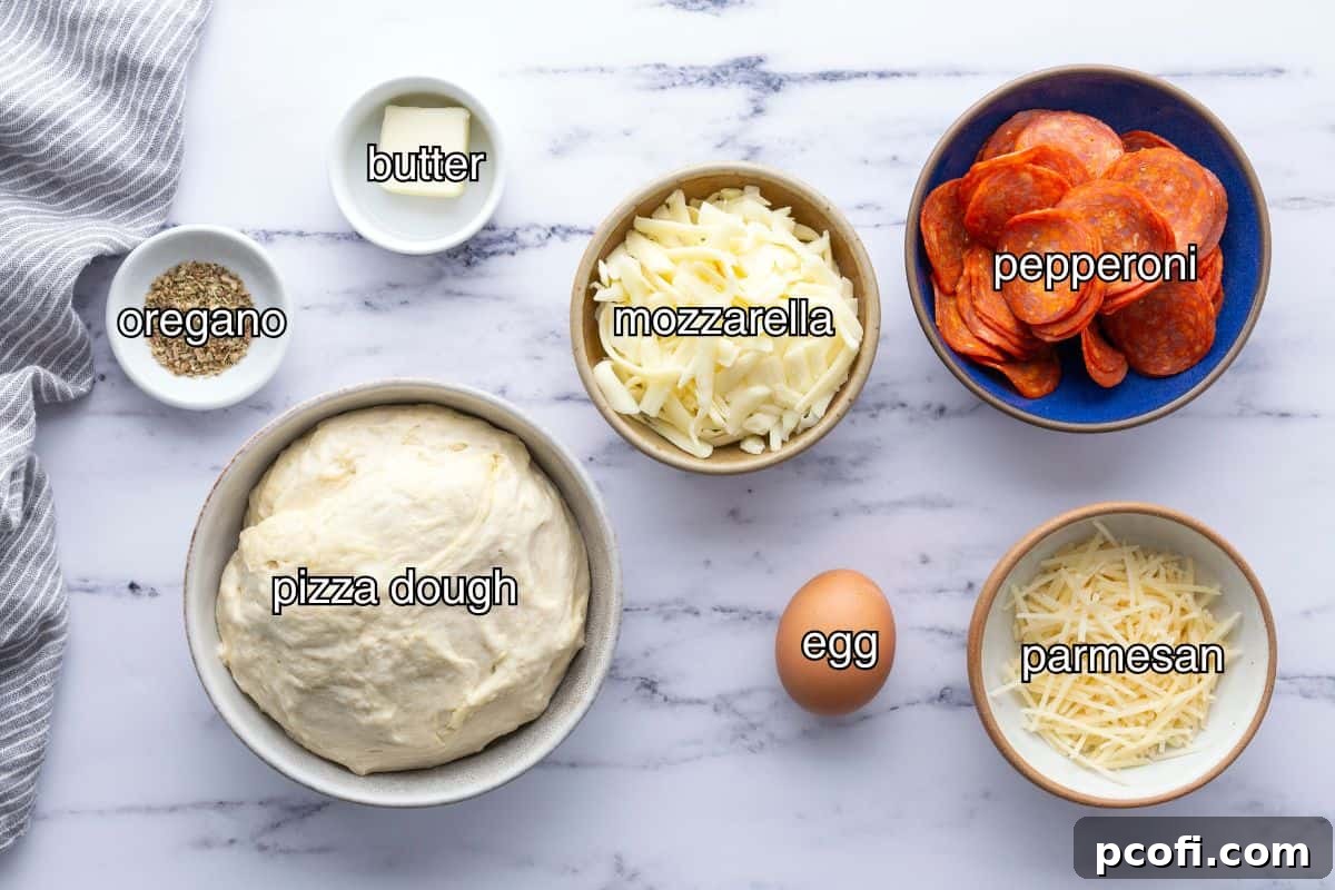 Separated ingredients for pepperoni bread, including flour, yeast, pepperoni, and various cheeses