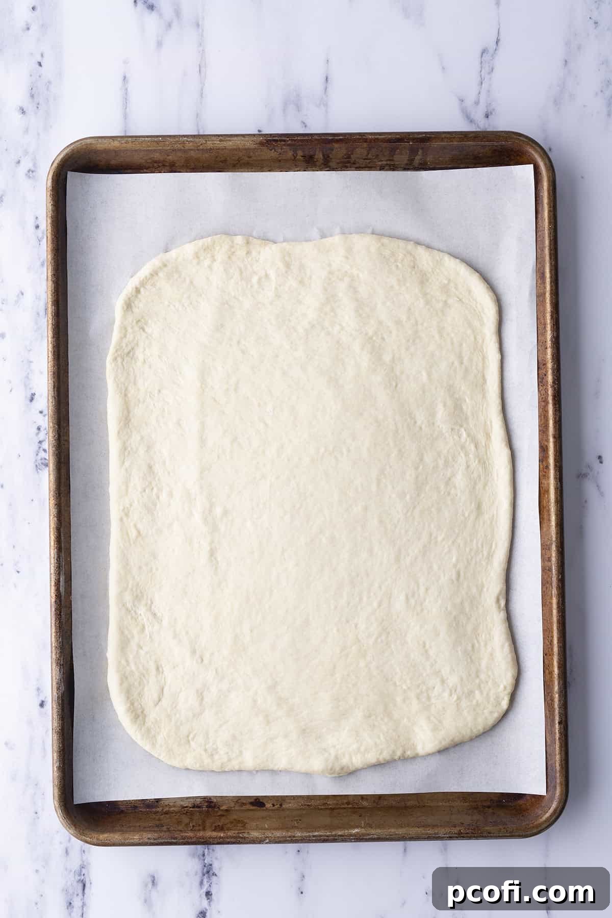 Rolled out pizza dough ready for toppings