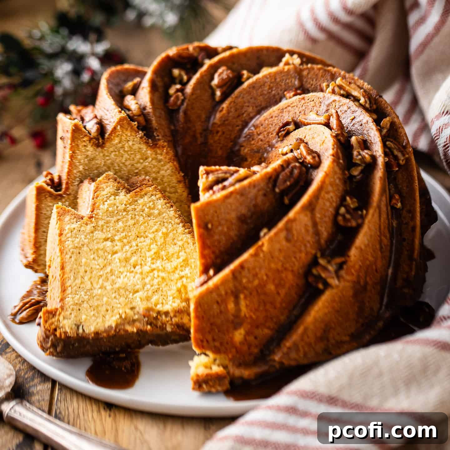 Rum cake drizzled with glaze and toasted pecans.