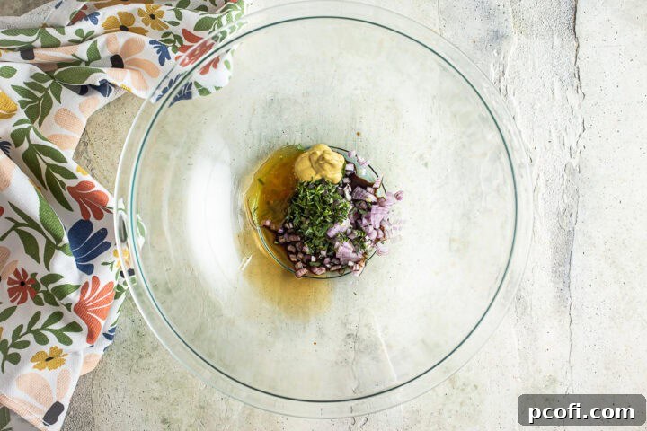 Dressing ingredients for the beet salad dressing before being mixed, showing shallots, vinegar, and other components.