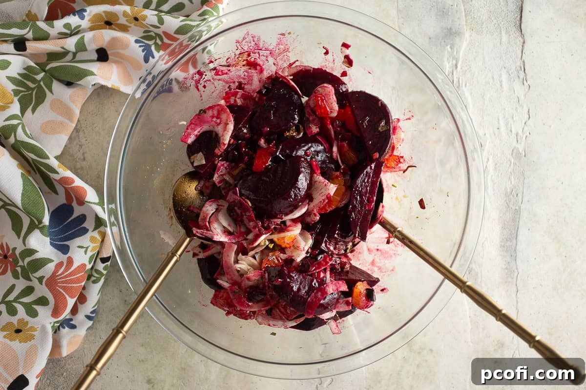 Beet salad after being tossed together with dressing, ready for garnishing.