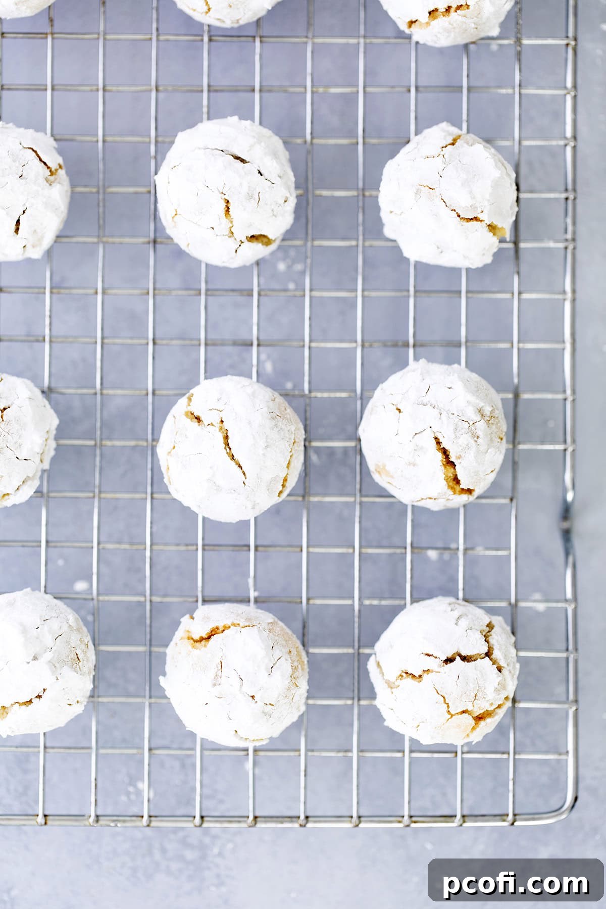 Amaretti cookies on a cooling rack.